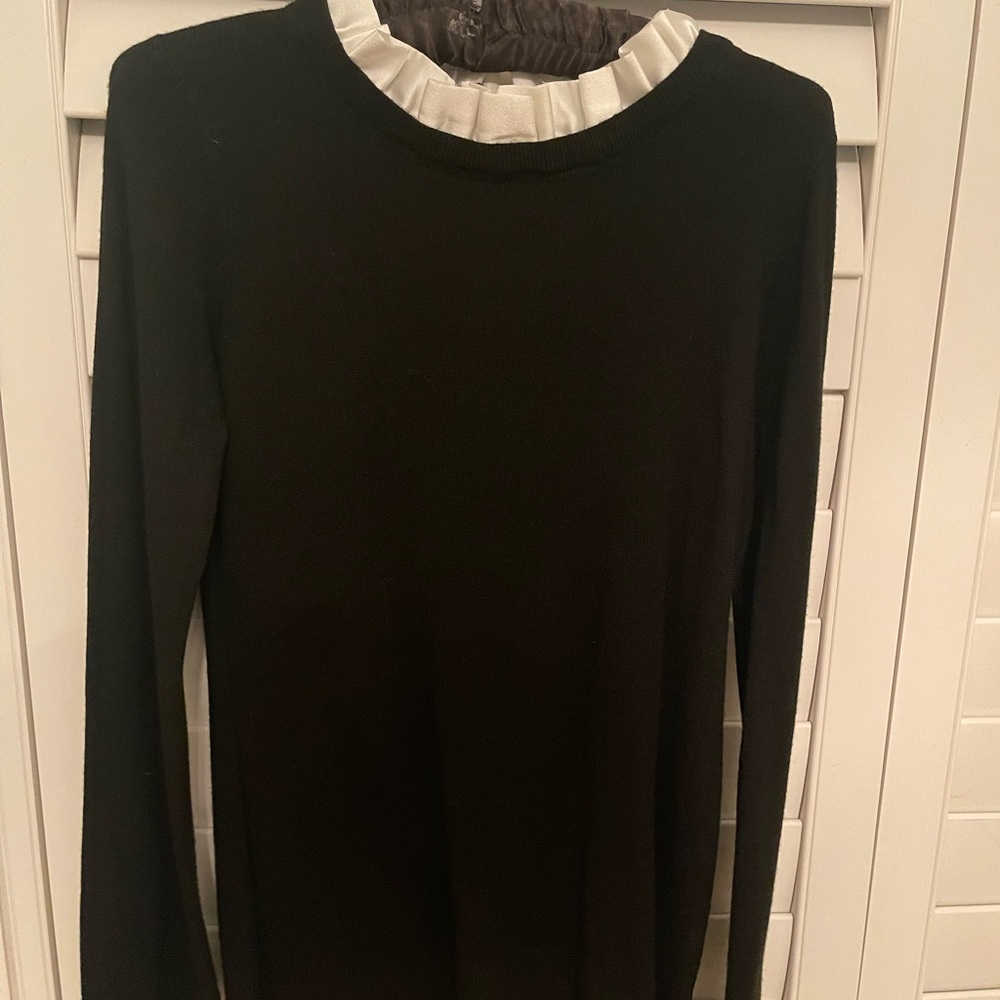 Chic Black Sweater with White Ruffle Neck and Cuffs